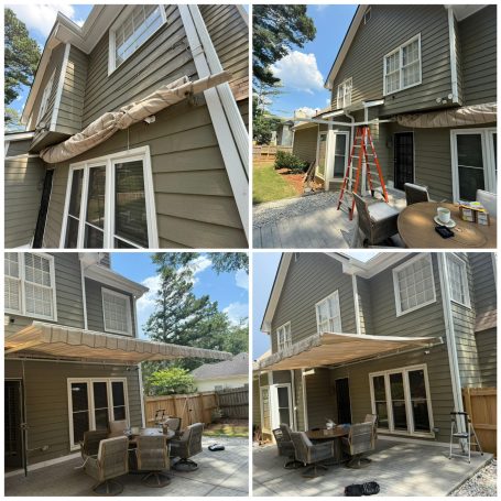Houses with under-construction awnings and patio seating area in a residential backyard.